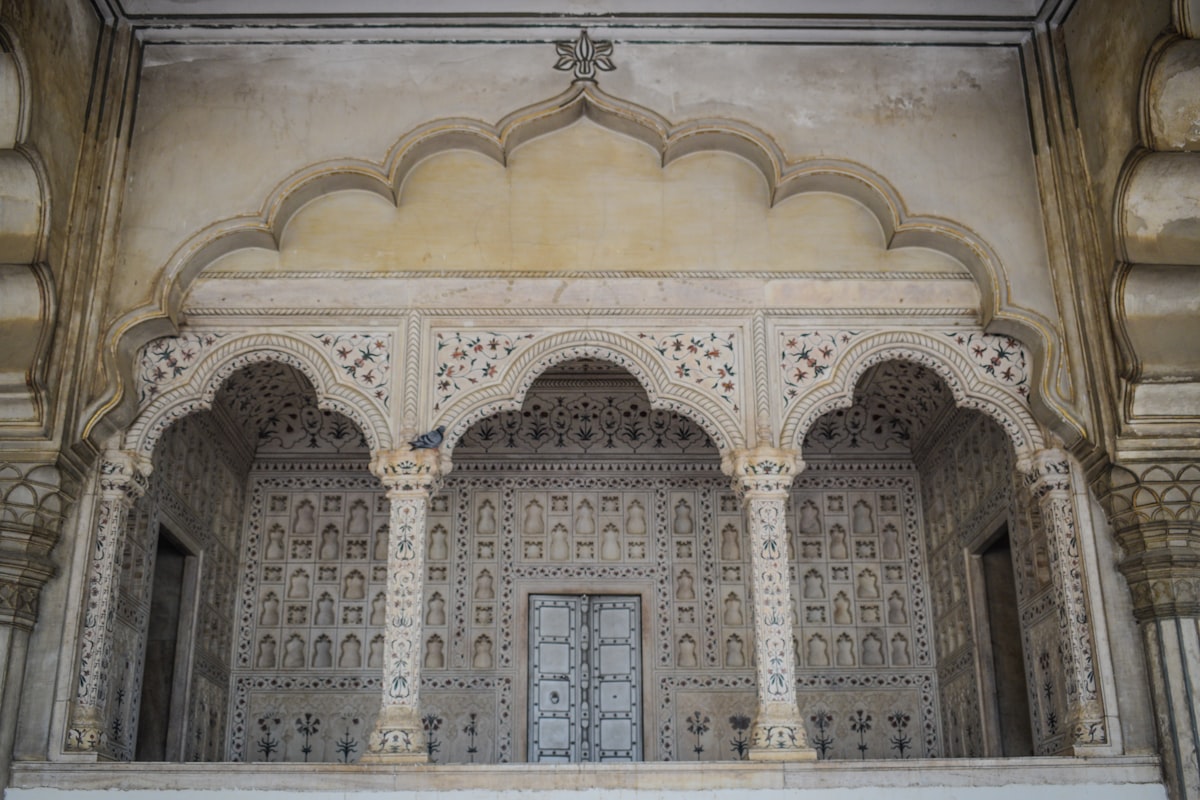 A large building with a doorway and a balcony