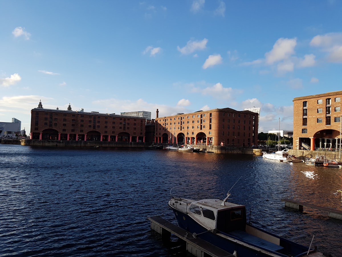 brown concrete building near body of water during daytime