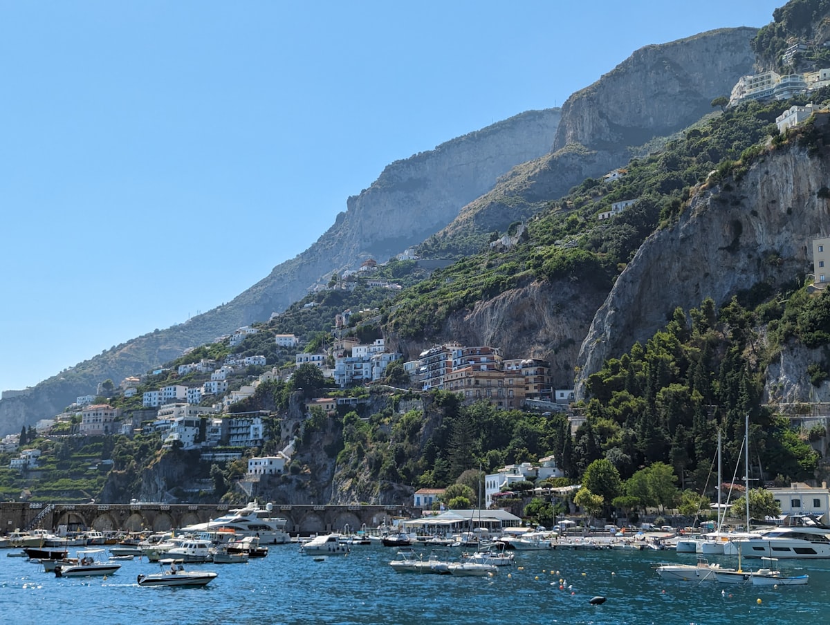 a group of boats floating on top of a body of water
