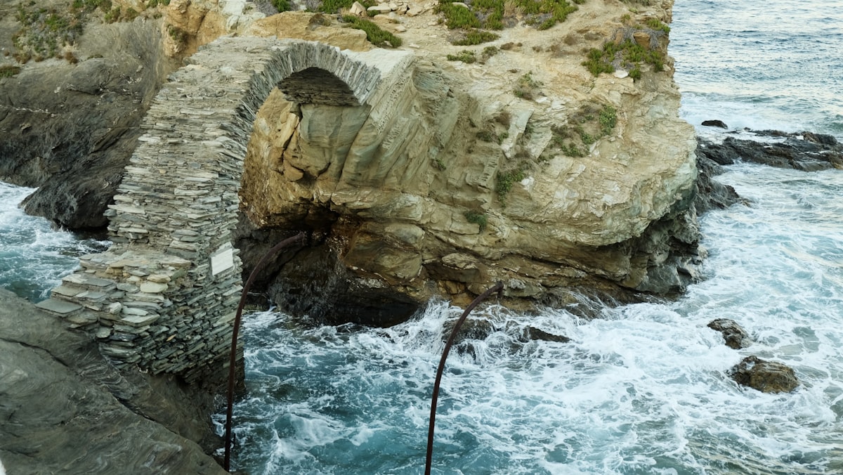 a large rock formation in the water