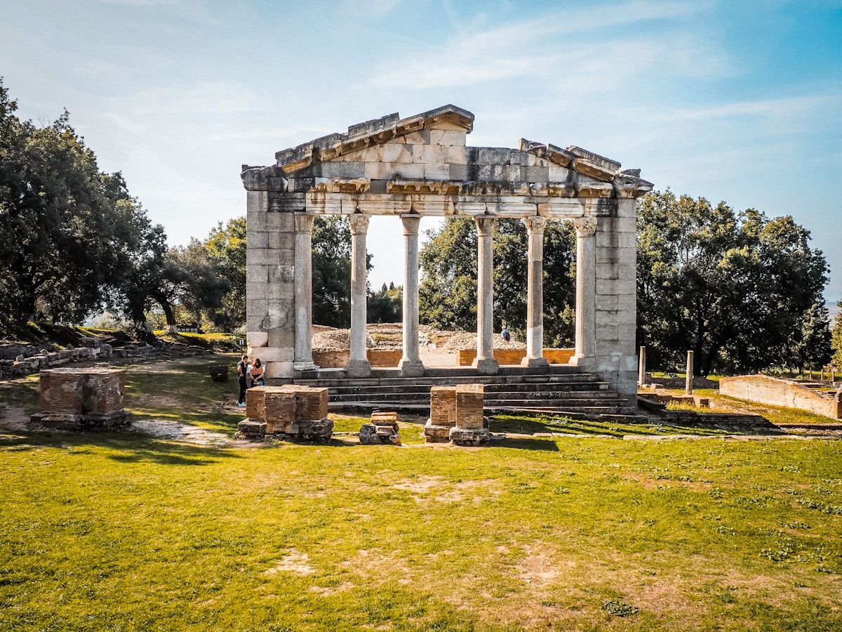 An ancient temple stands under a sunny sky.