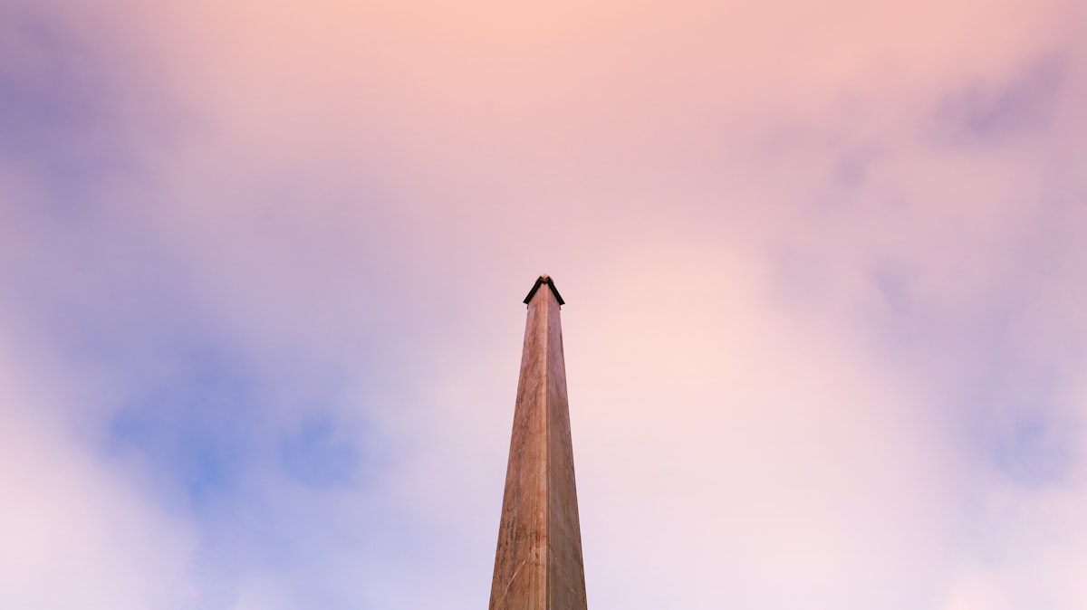 A tall building with a clock on the top of it