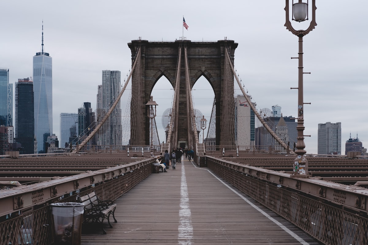 people walking on bridge during daytime