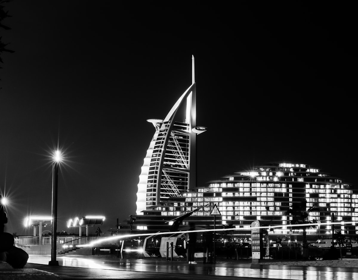 a black and white photo of a city at night