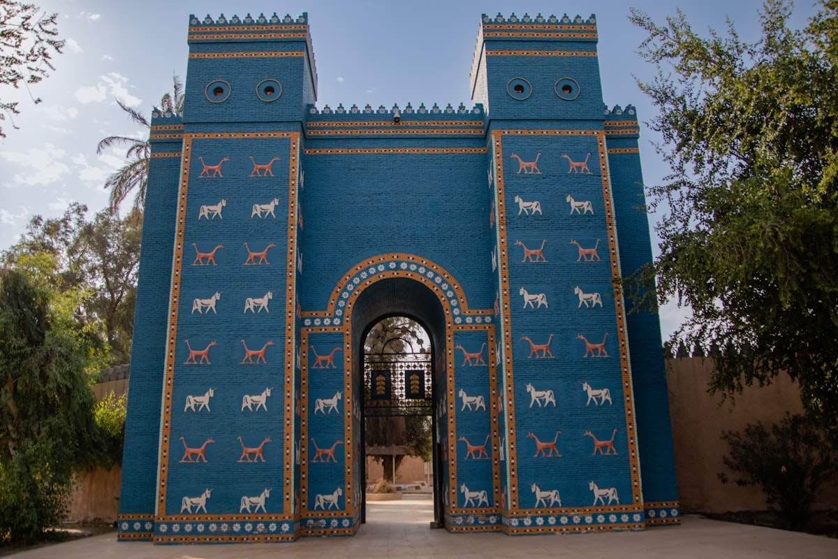 A large blue gate with horses painted on it