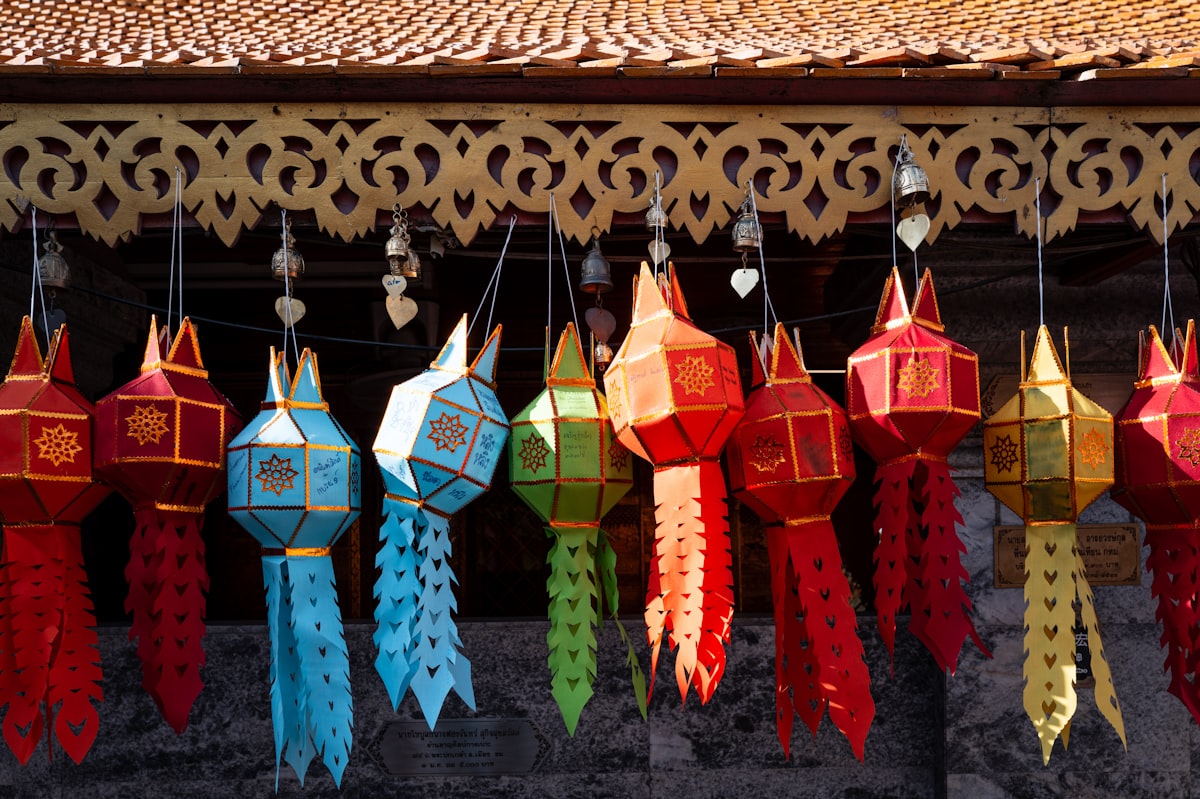 A row of colorful ribbons hanging from a roof