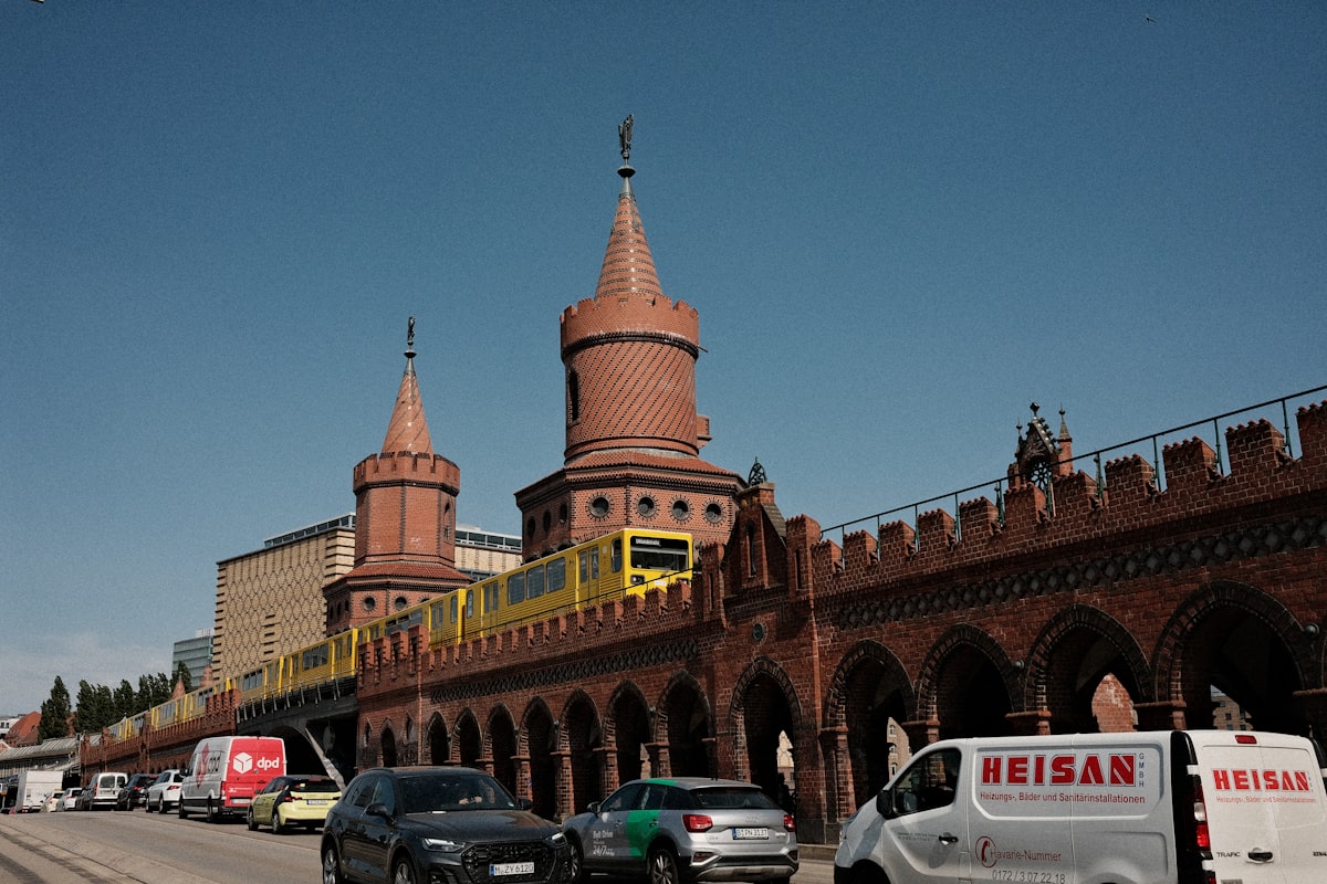a train on a train track near a building