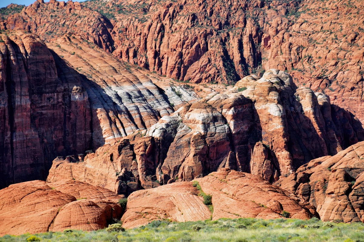 a large mountain with a very tall mountain in the background