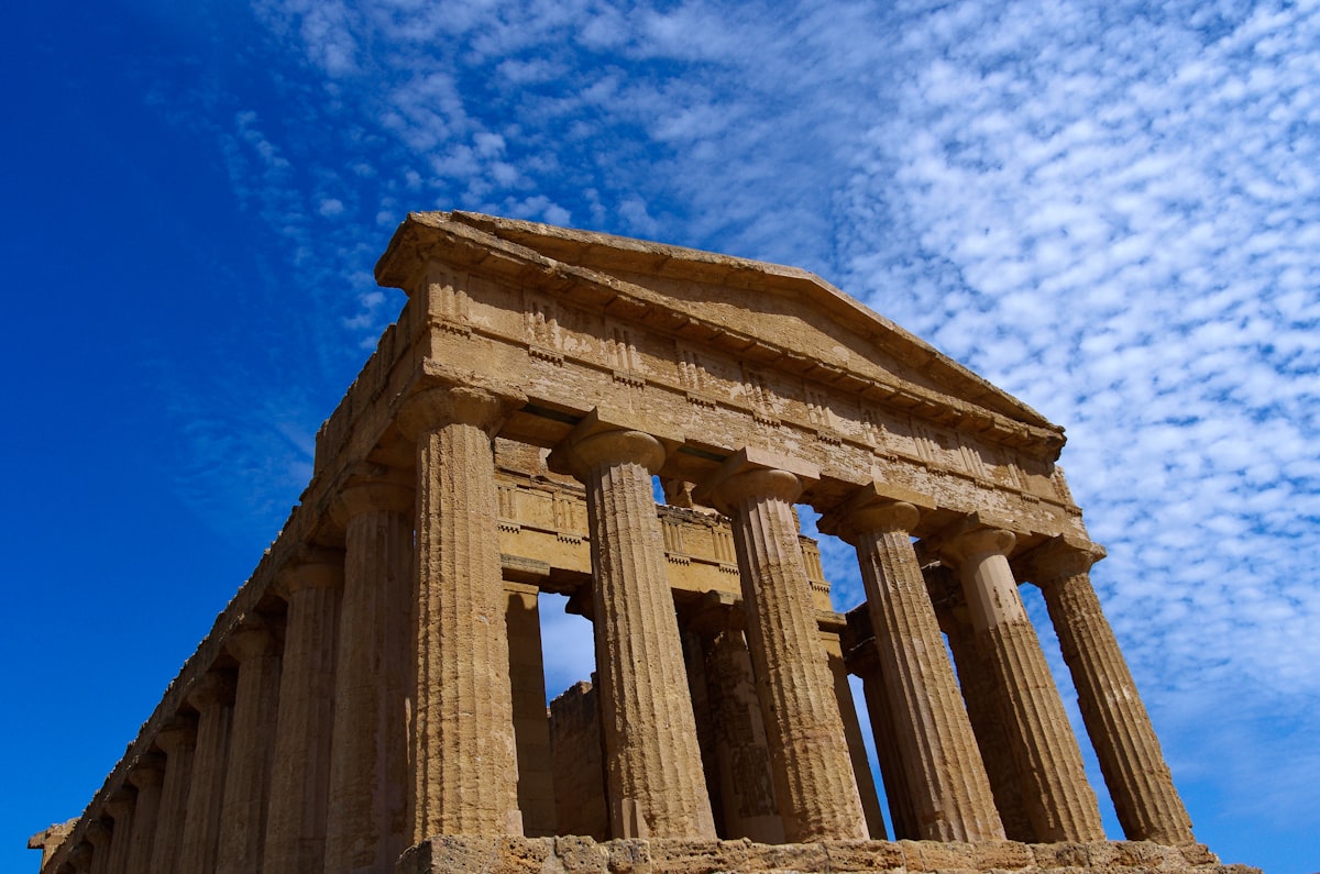 A large stone structure sitting under a blue sky