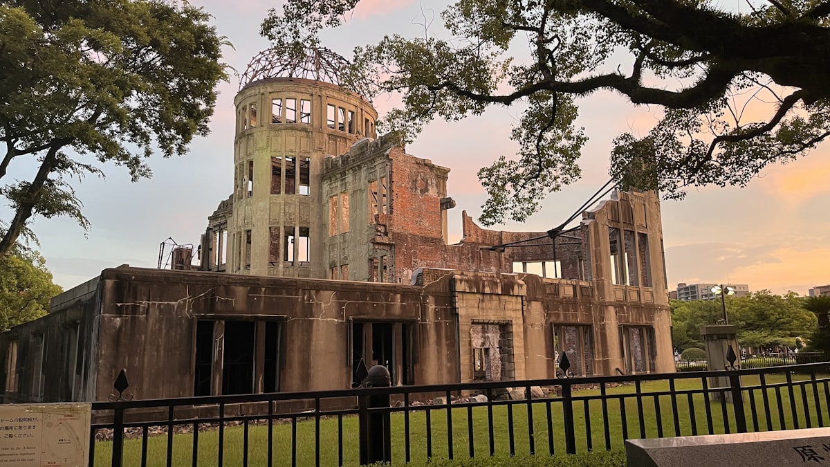 a large building with a fence in front of it