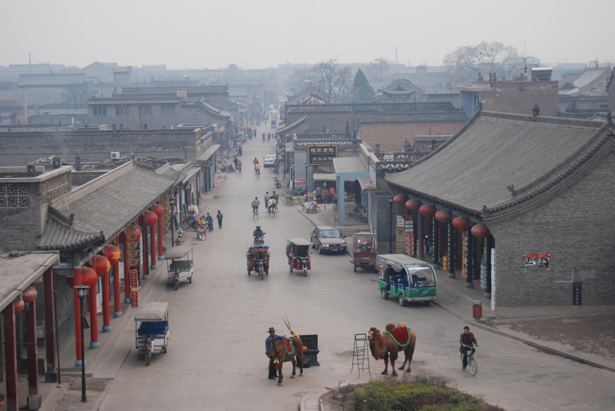 cars parked on street near buildings during daytime