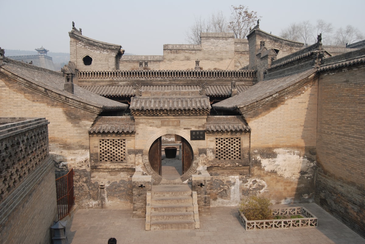 a stone building with a staircase leading up to it