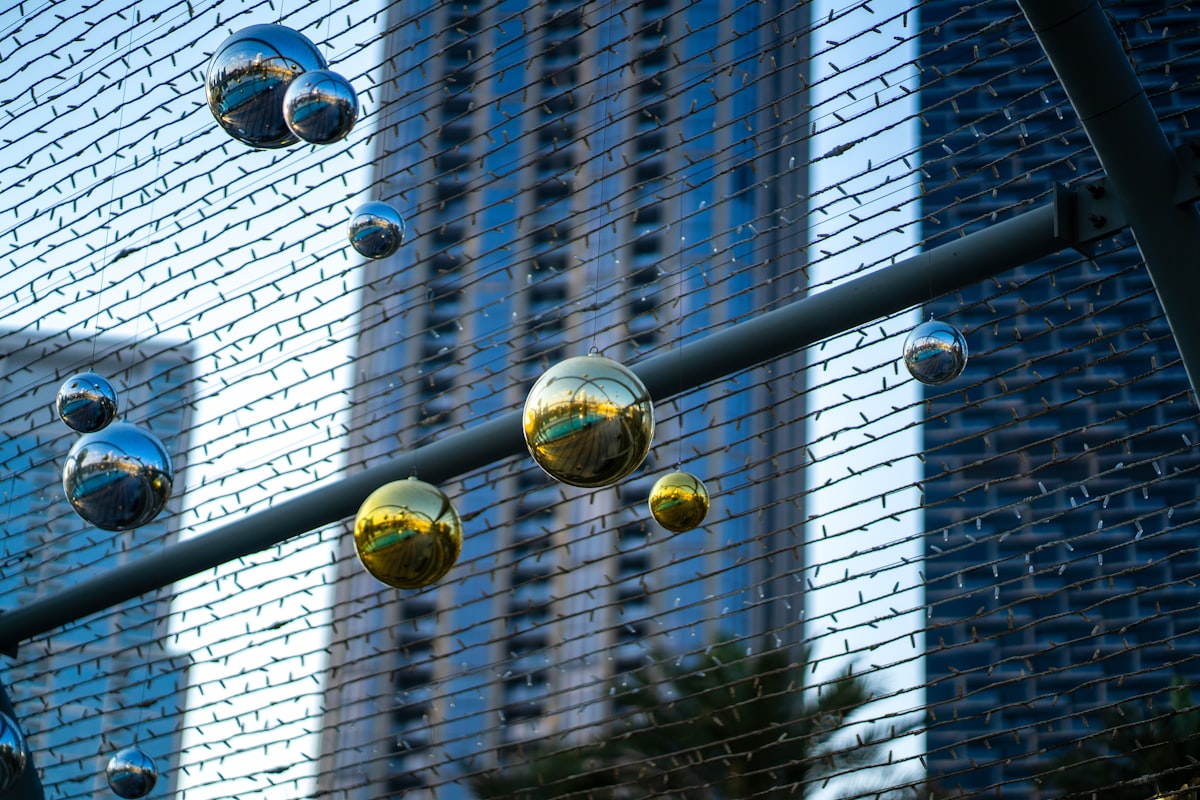 A bunch of balls that are on a fence