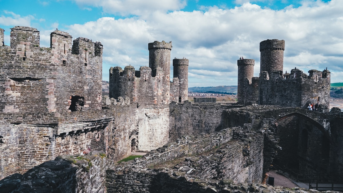 a stone castle with a bridge
