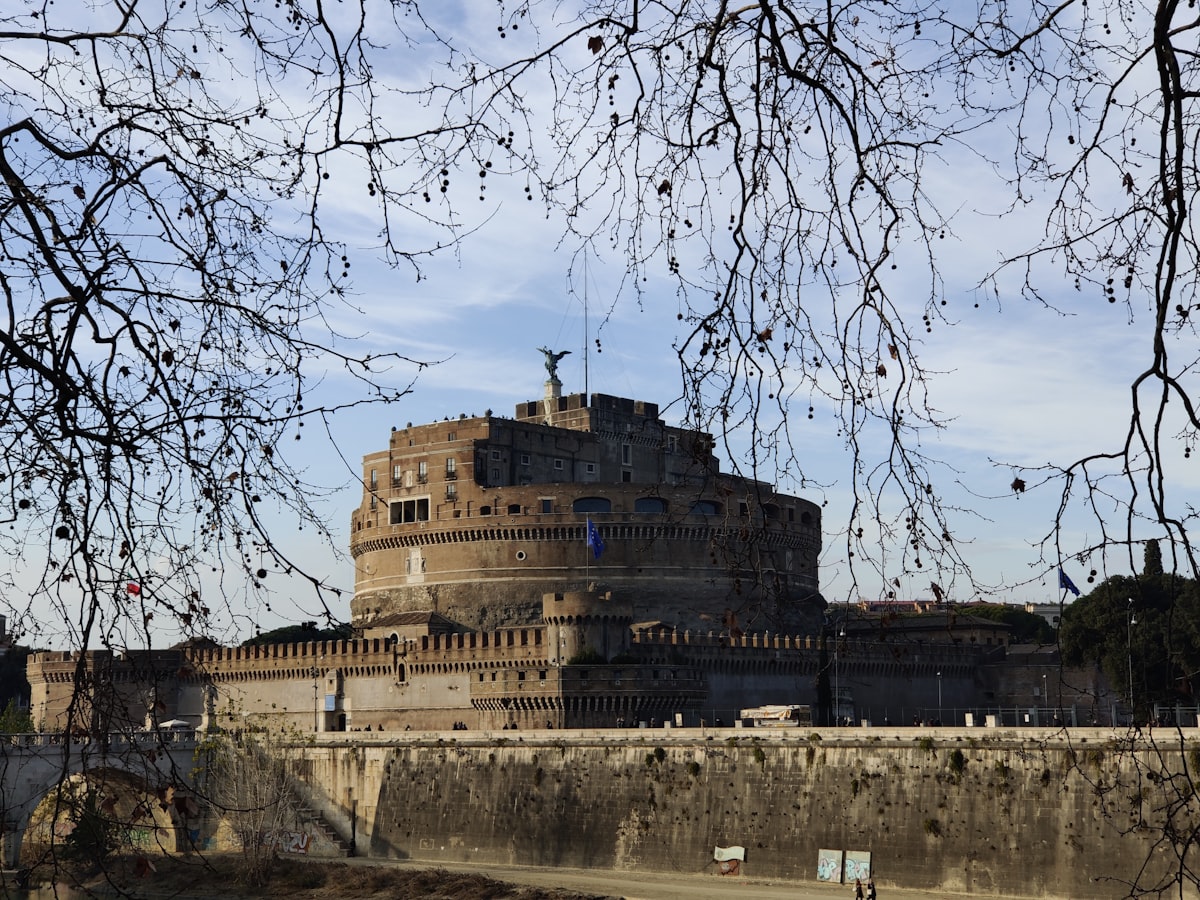 a very tall building sitting on top of a bridge