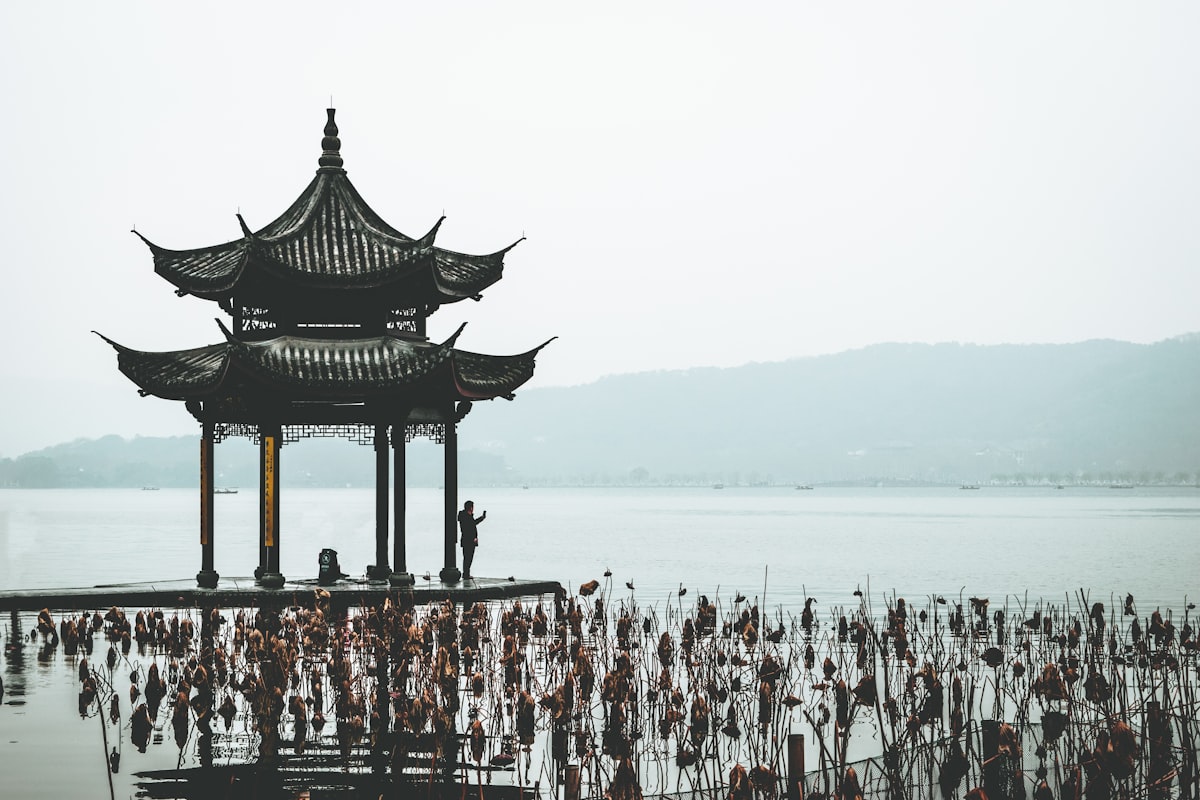 brown wooden gazebo on beach during daytime