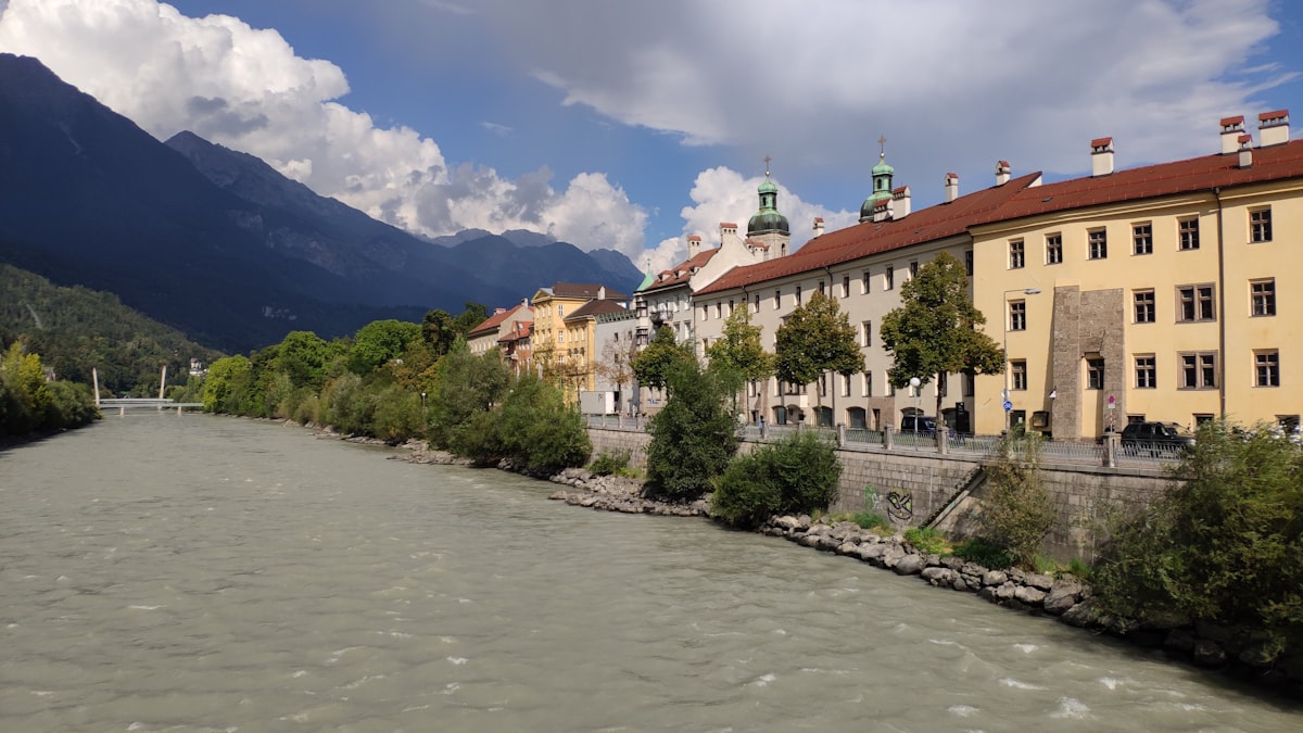 a river running through a city next to tall buildings