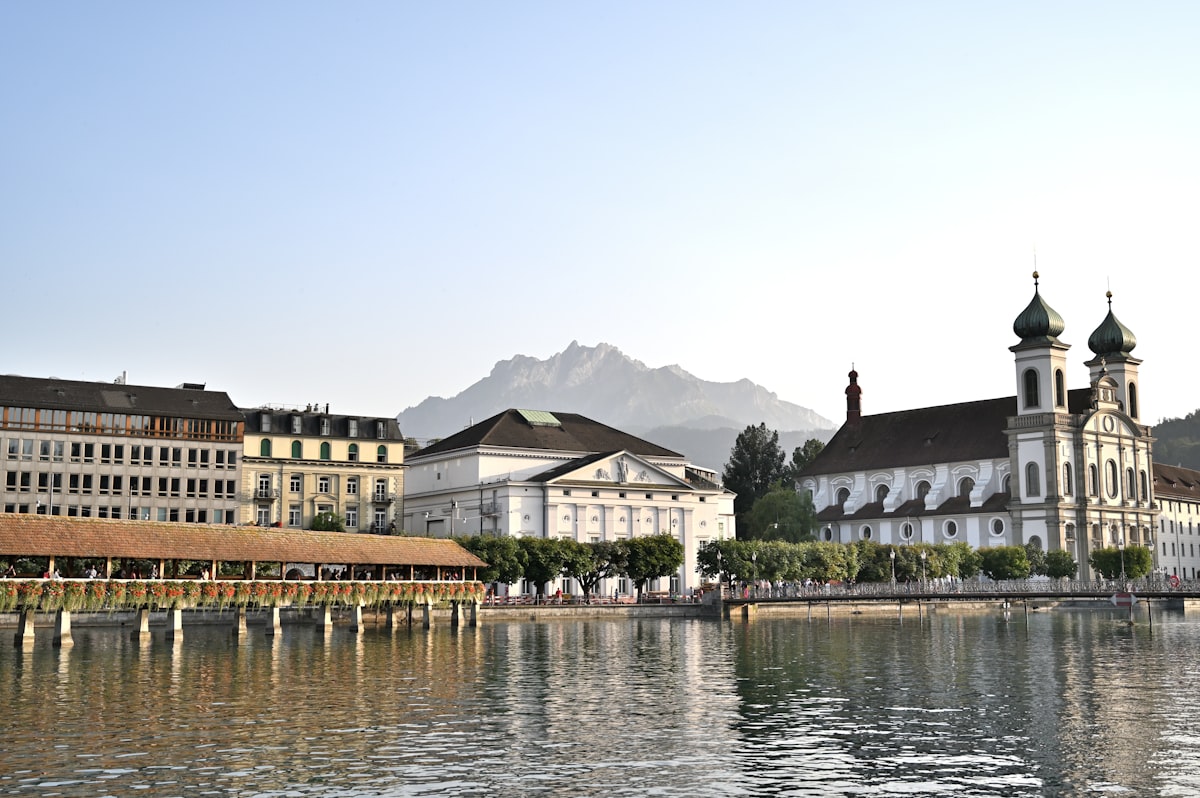 Cityscape with wooden bridge and church by water