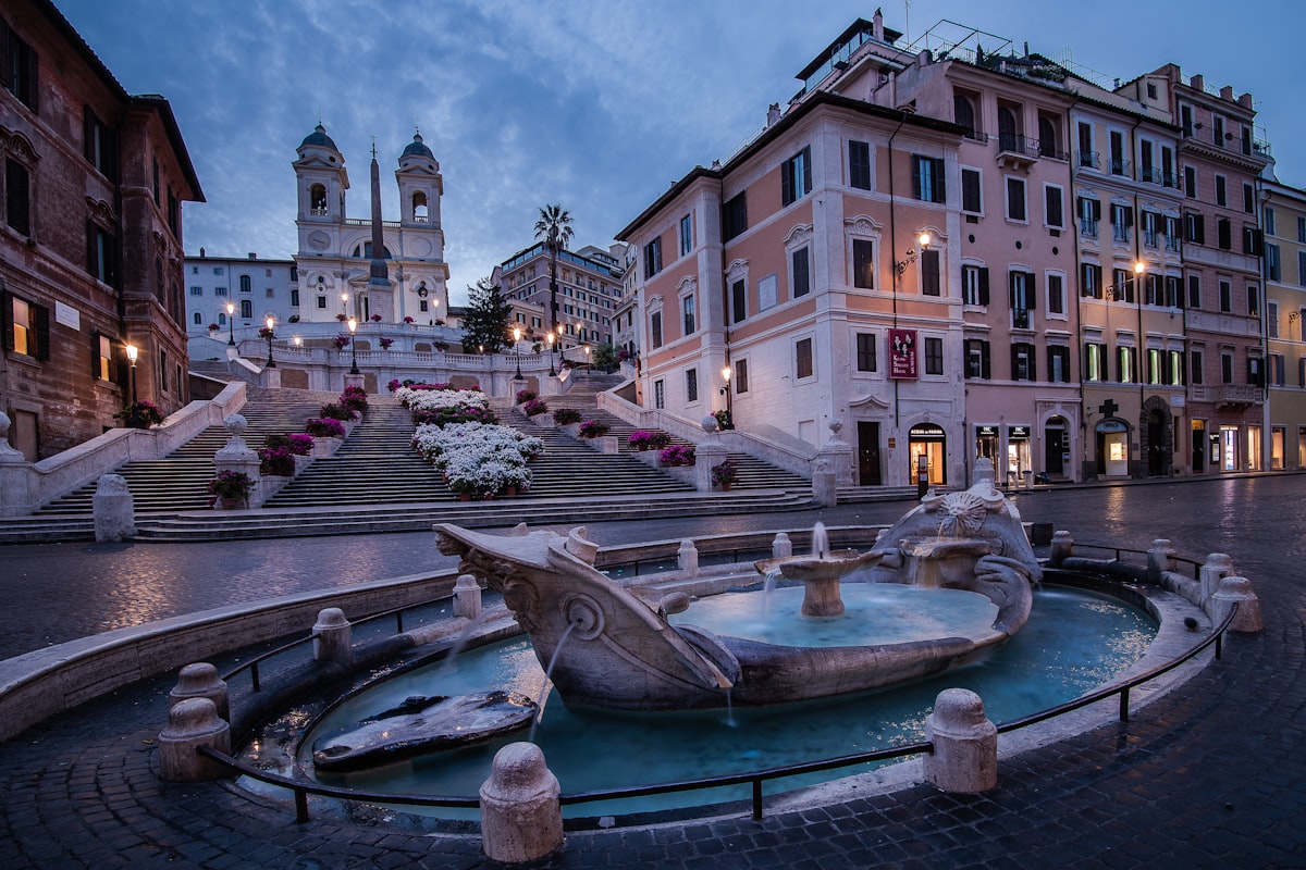 a fountain in the middle of a town square