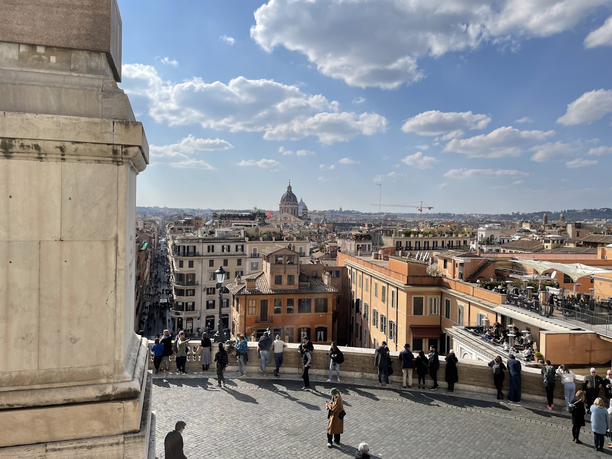 a group of people standing on top of a building