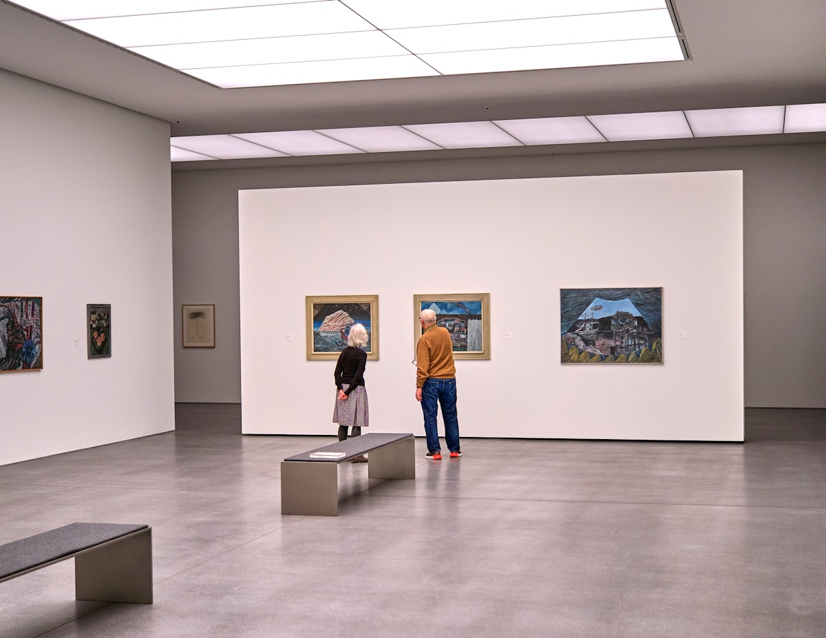 a couple of people that are looking at some pictures