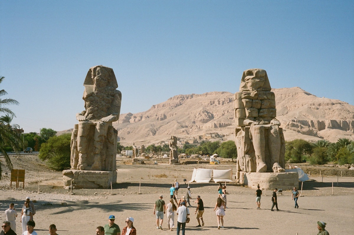 The colossi of memnon stand tall in egypt.