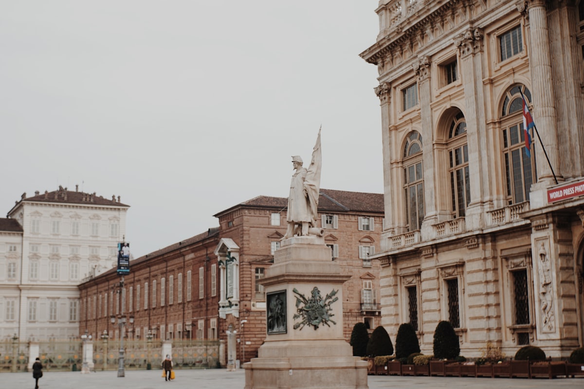 people walking on street near brown concrete building during daytime