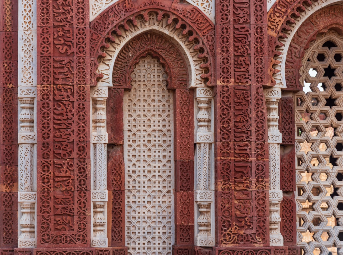 Intricate carvings on ancient red sandstone architecture