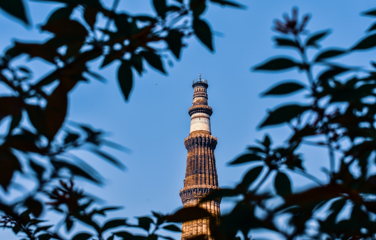 a tall tower with a clock on the top of it