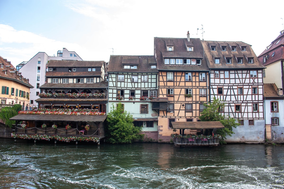 A river running through a city next to tall buildings