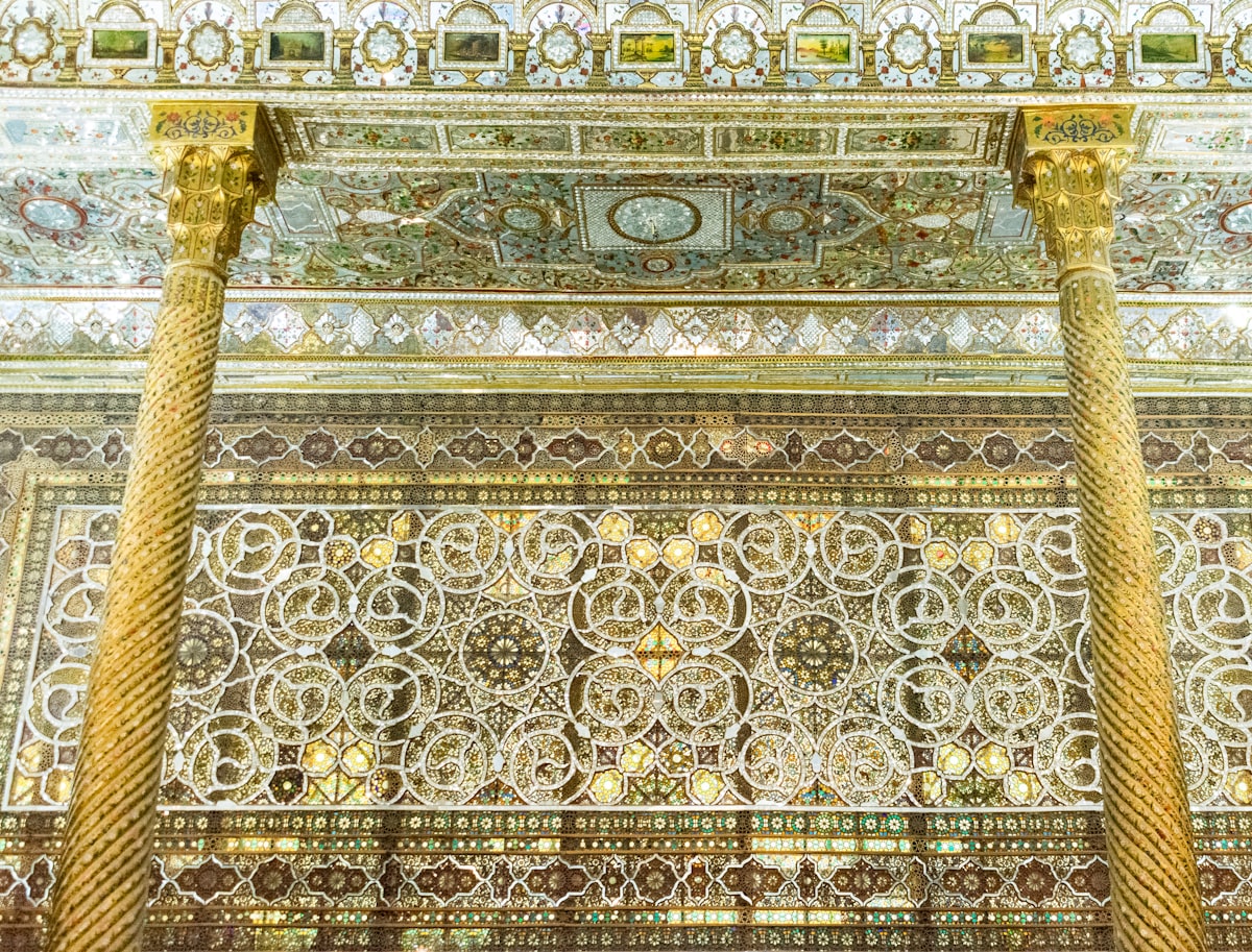 Intricate patterns adorn ornate columns and ceiling