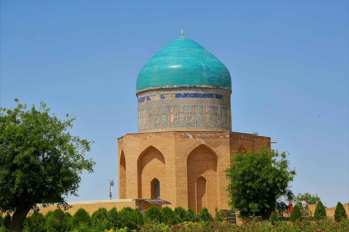green and brown dome building under blue sky during daytime