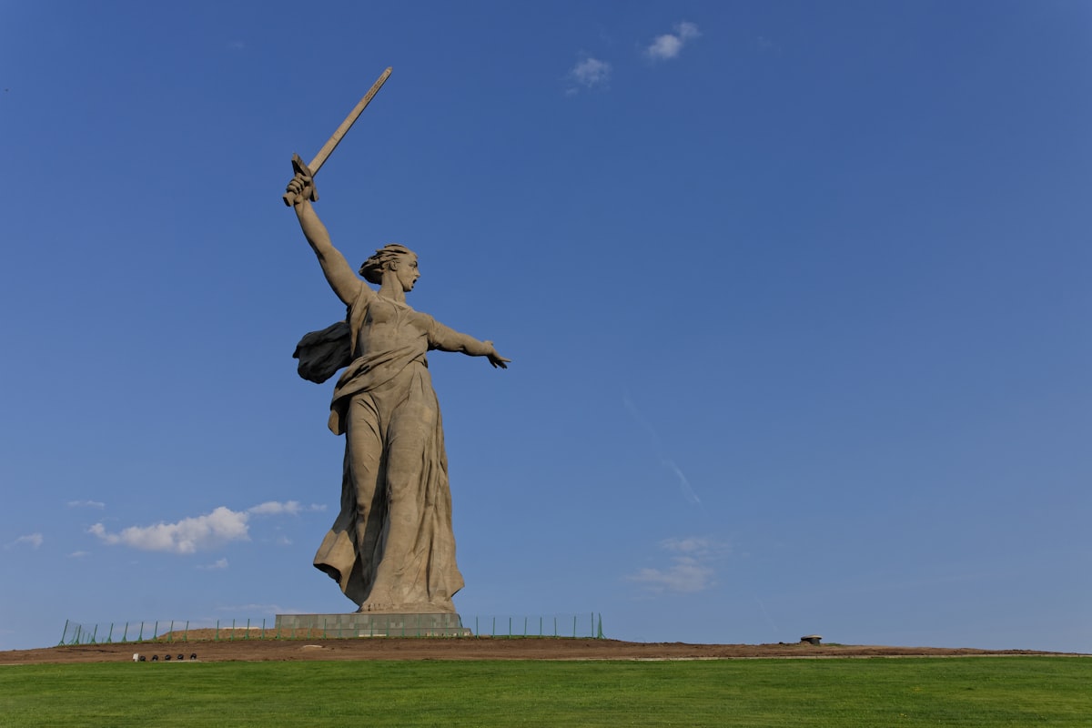 a statue of a woman holding a baseball bat