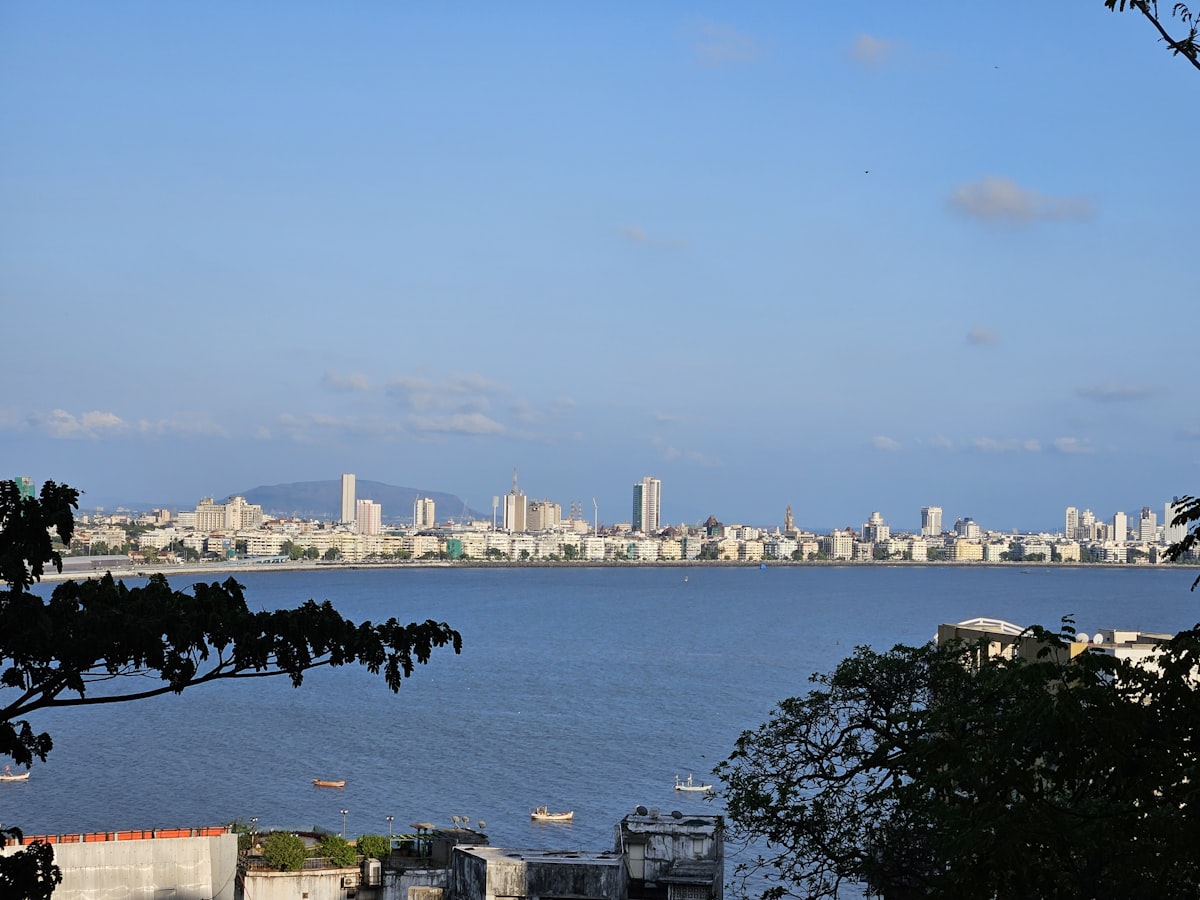 A city skyline over a body of water.