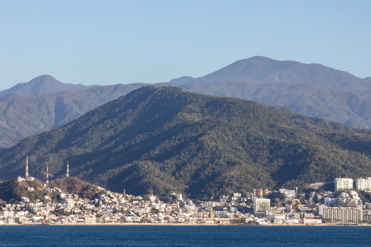A large body of water with mountains in the background