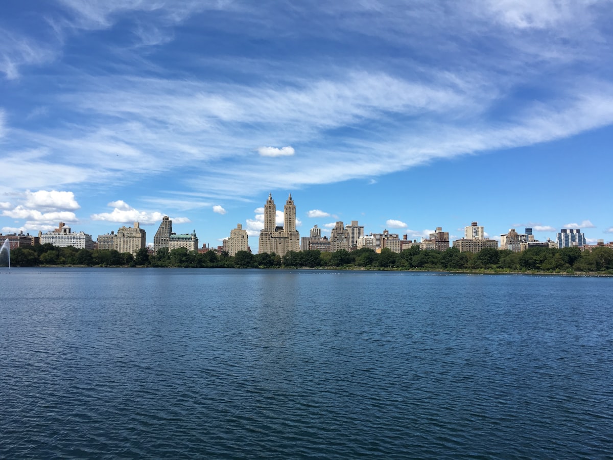 A large body of water with a city in the background