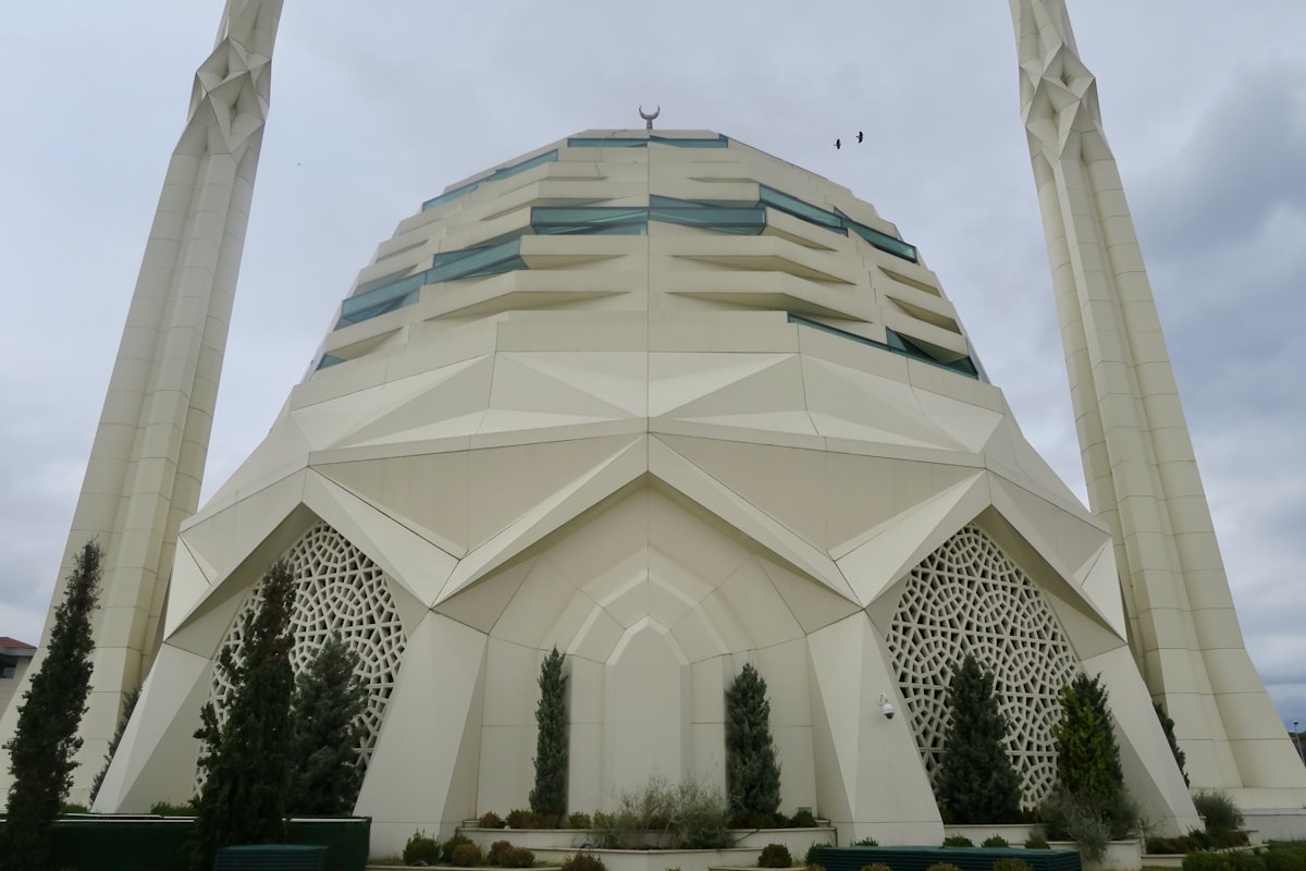 a large white building with two tall towers
