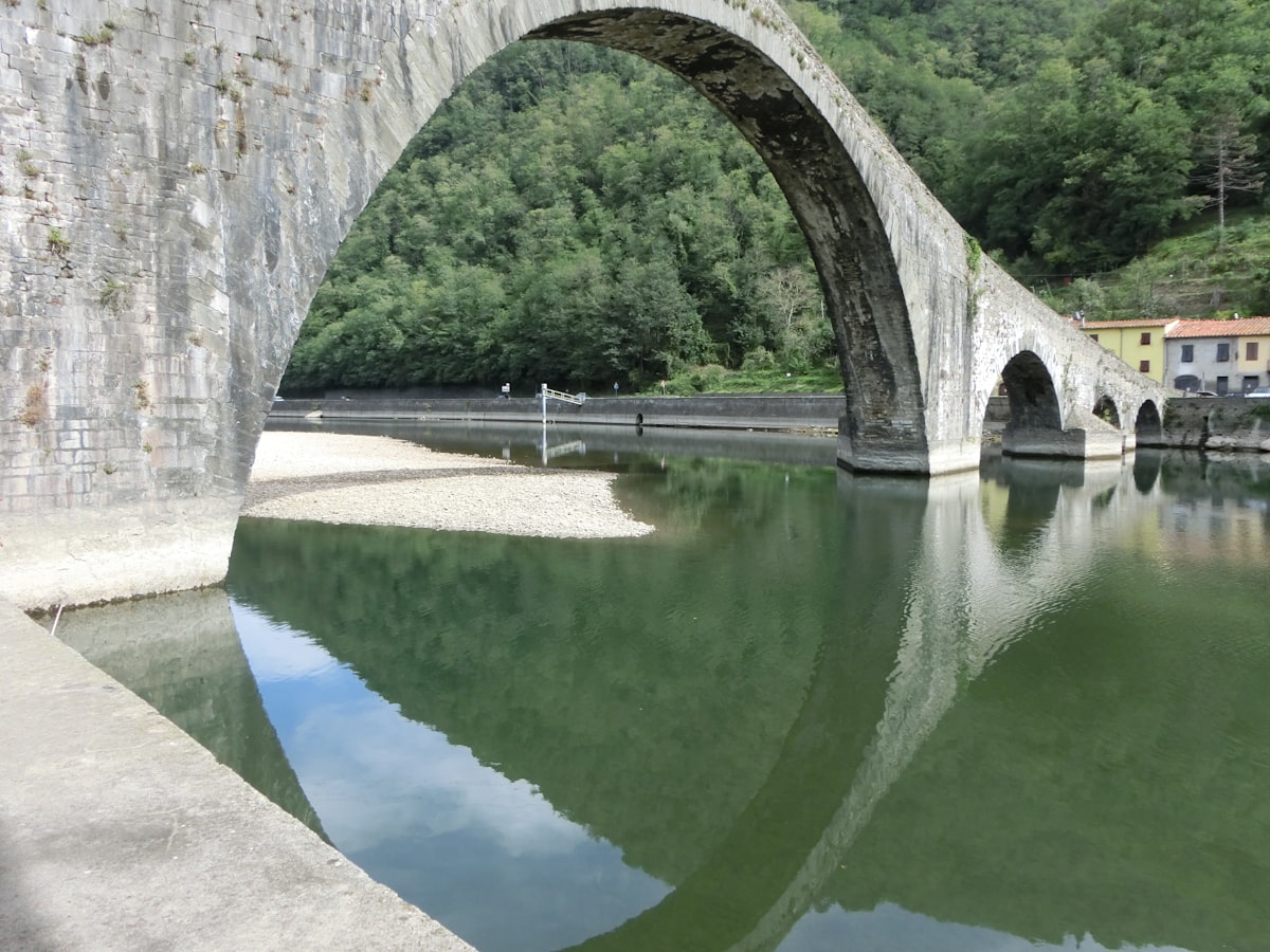 a stone bridge over a body of water