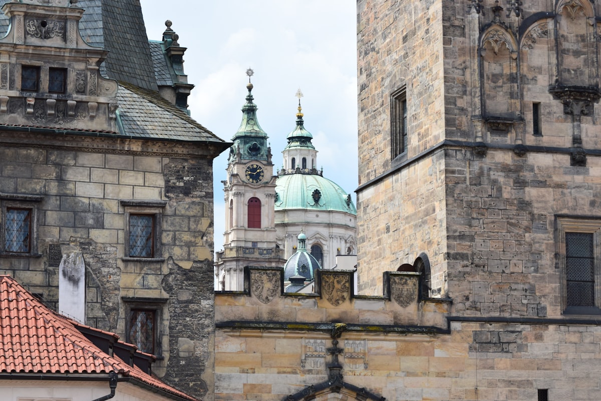 a view of a building with a clock tower in the background