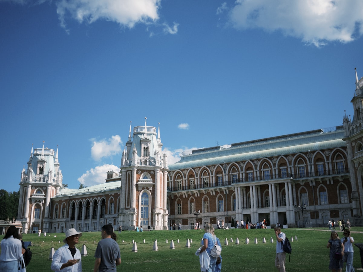 A group of people standing in front of a building