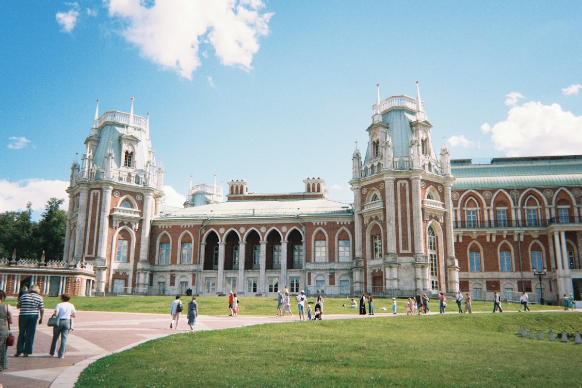 A group of people standing in front of a large building