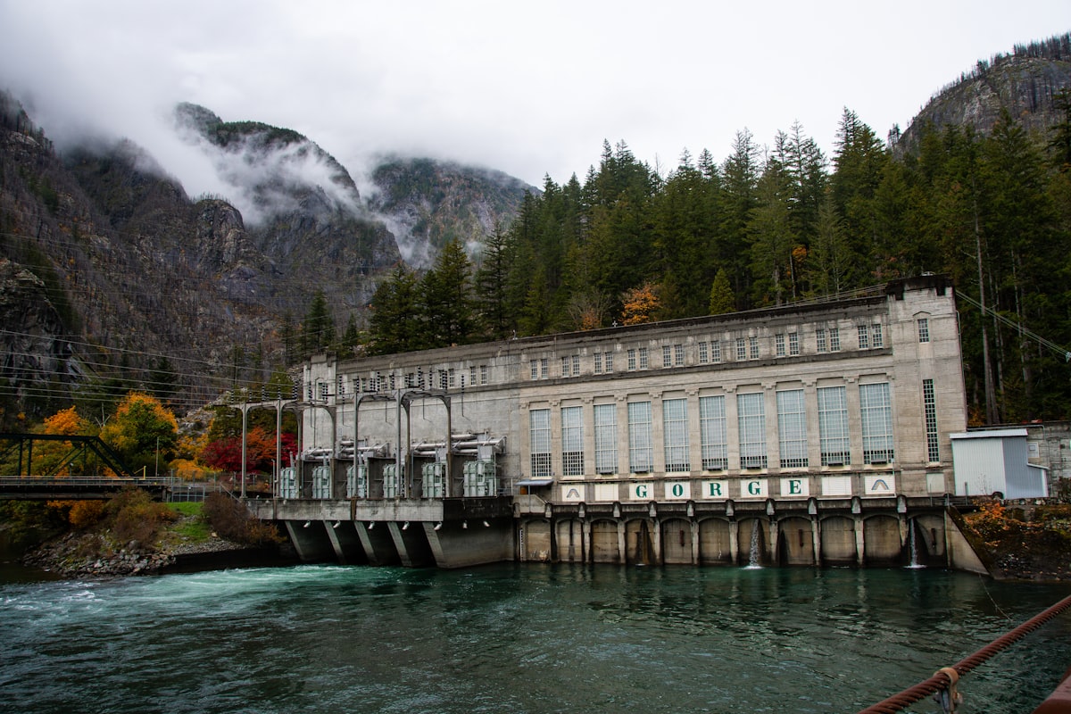 a large building sitting on the side of a river