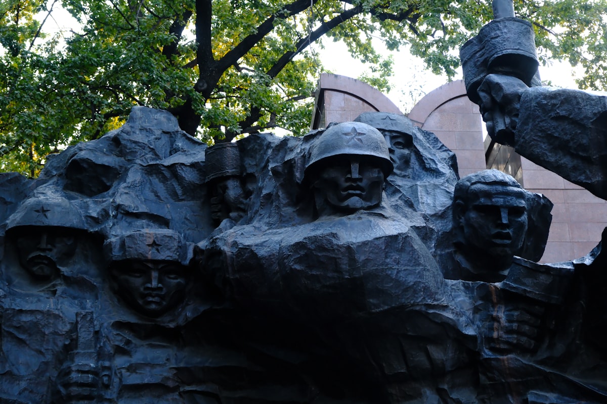 Sculpture of soldiers in helmets with helmets and rifles