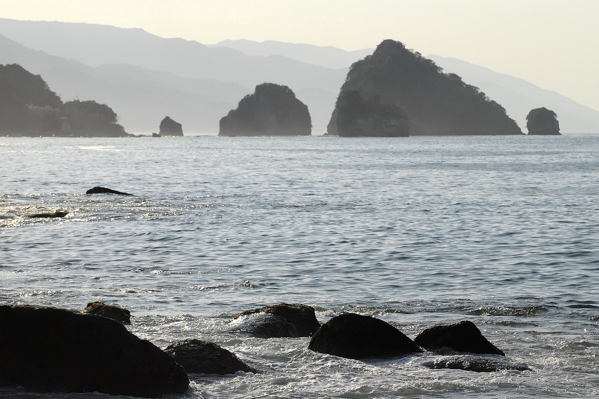 Rocky islands in the ocean at sunset