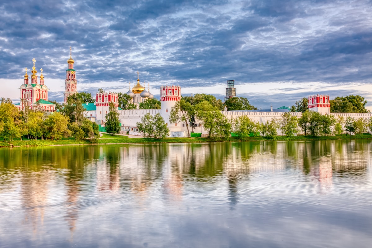 A beautiful monastery reflects in the water.