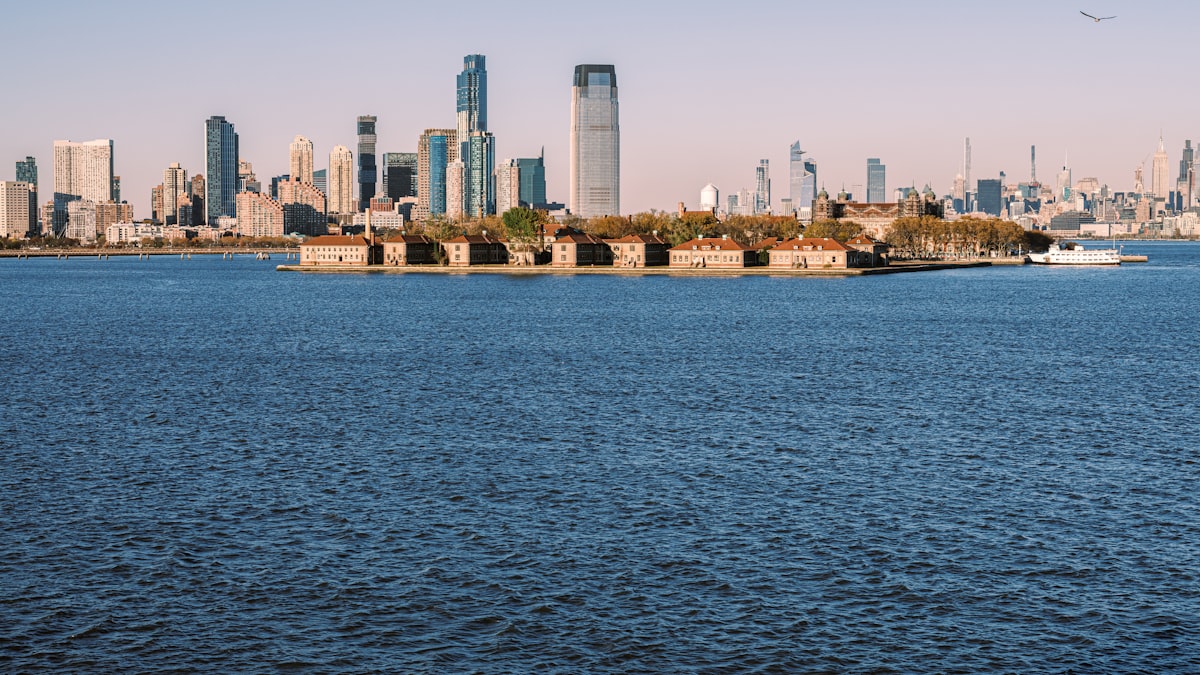 A large body of water with a city in the background