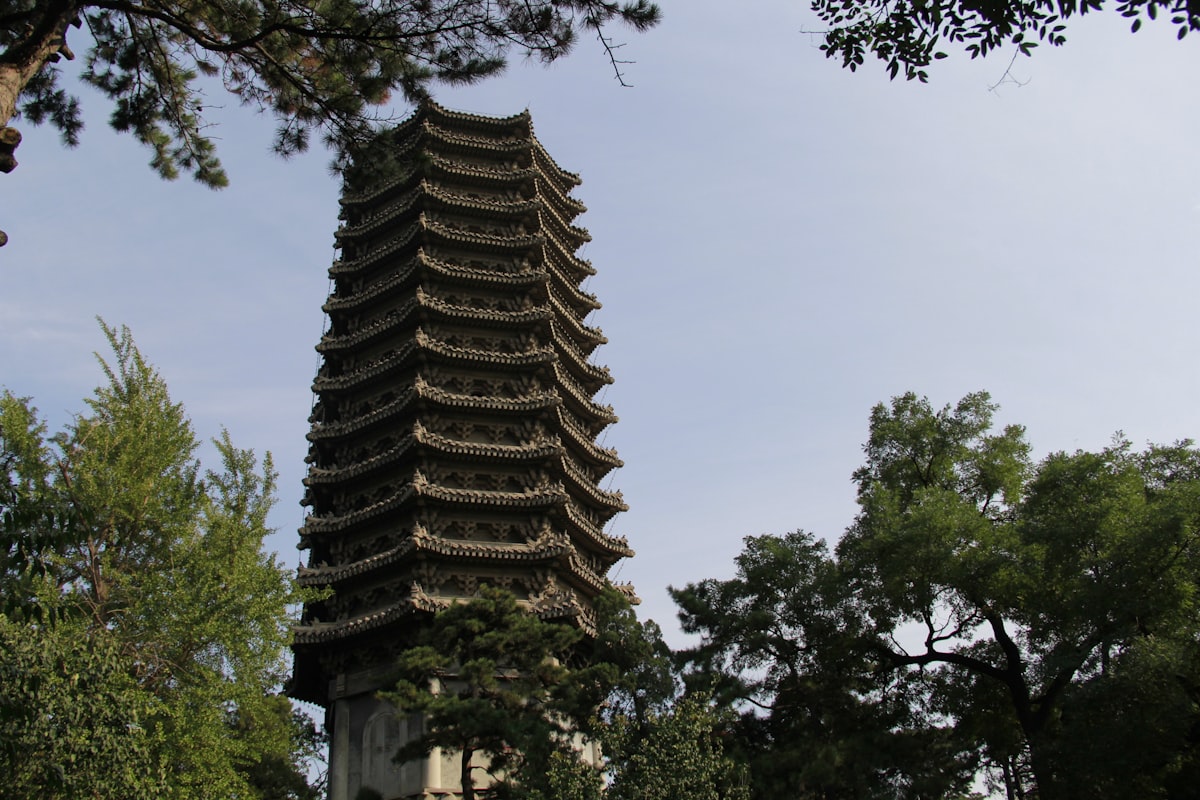 a tall tower with a clock on the top of it