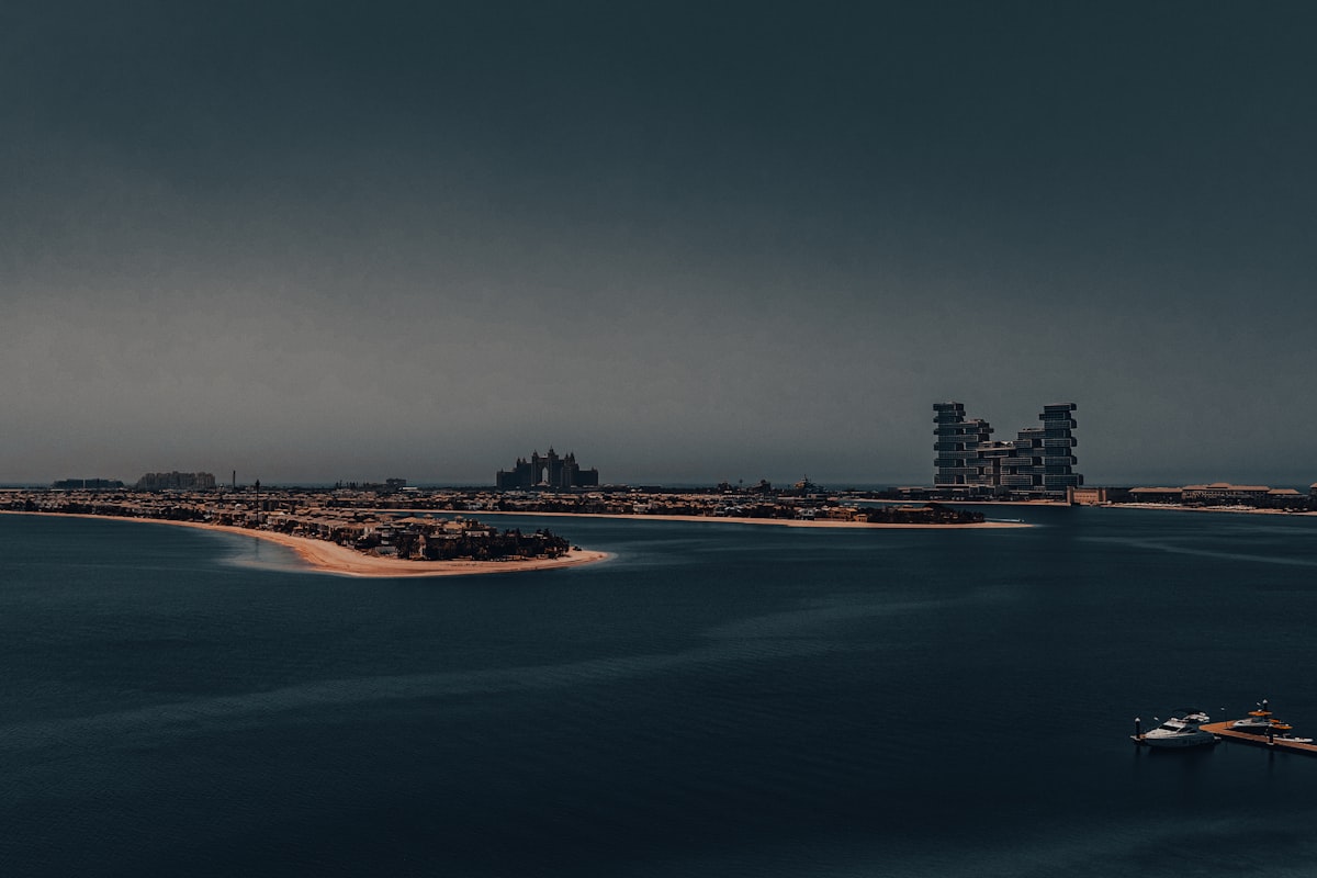 A large body of water with a city in the background