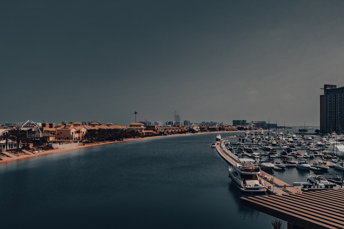 A harbor filled with lots of boats under a cloudy sky