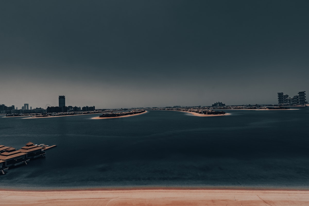 A large body of water with a city in the background